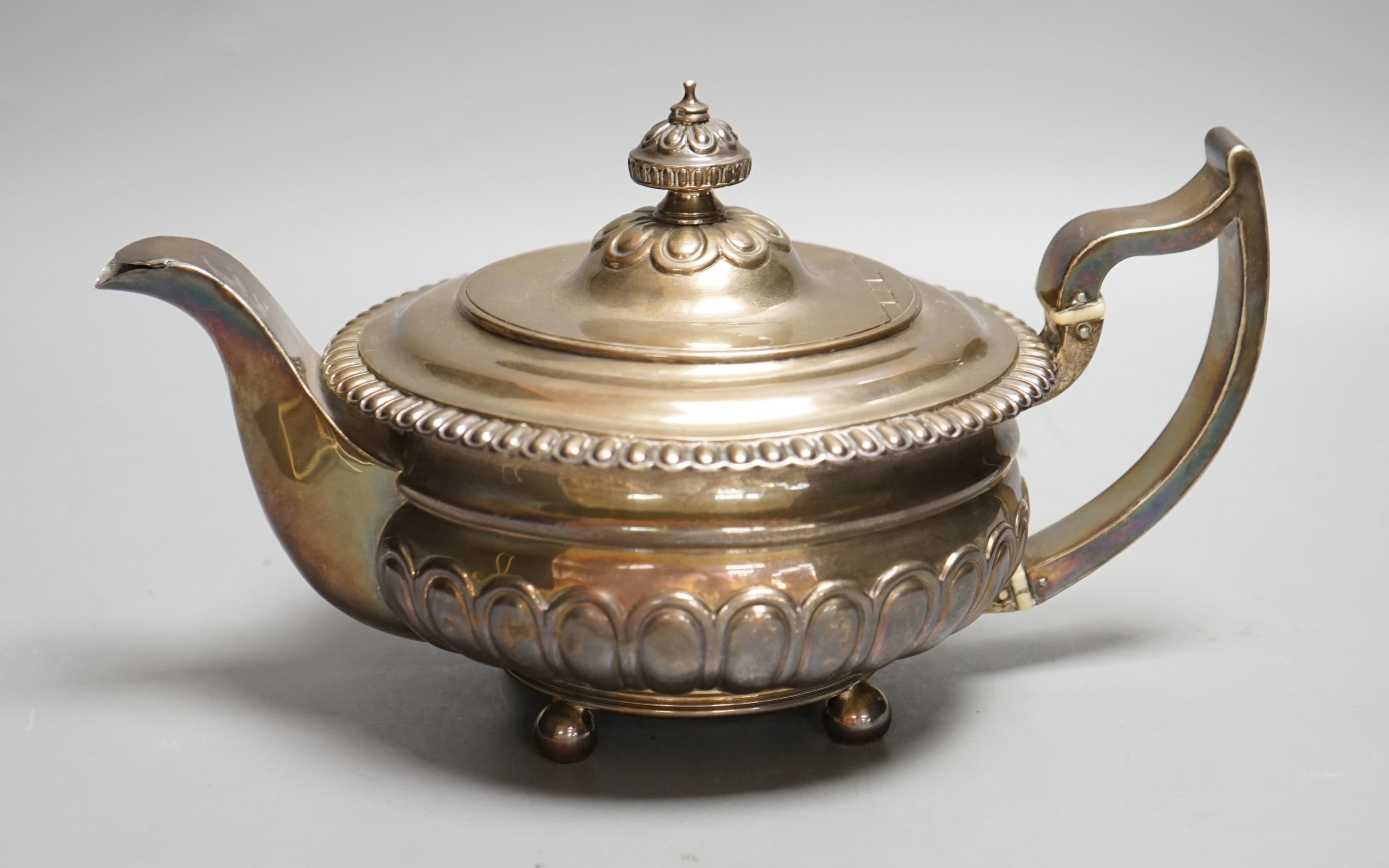 A George III silver teapot, Soloman Hougham, London, 1813, gross 23.5oz.